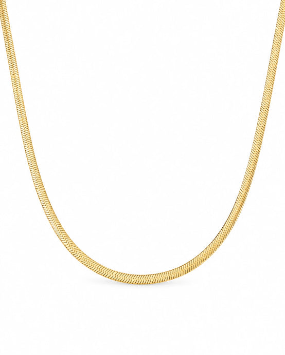 FLEURENZ DEANNE gold herringbone necklace on a white background